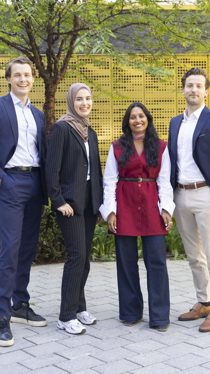 established professionals smiling for the camera